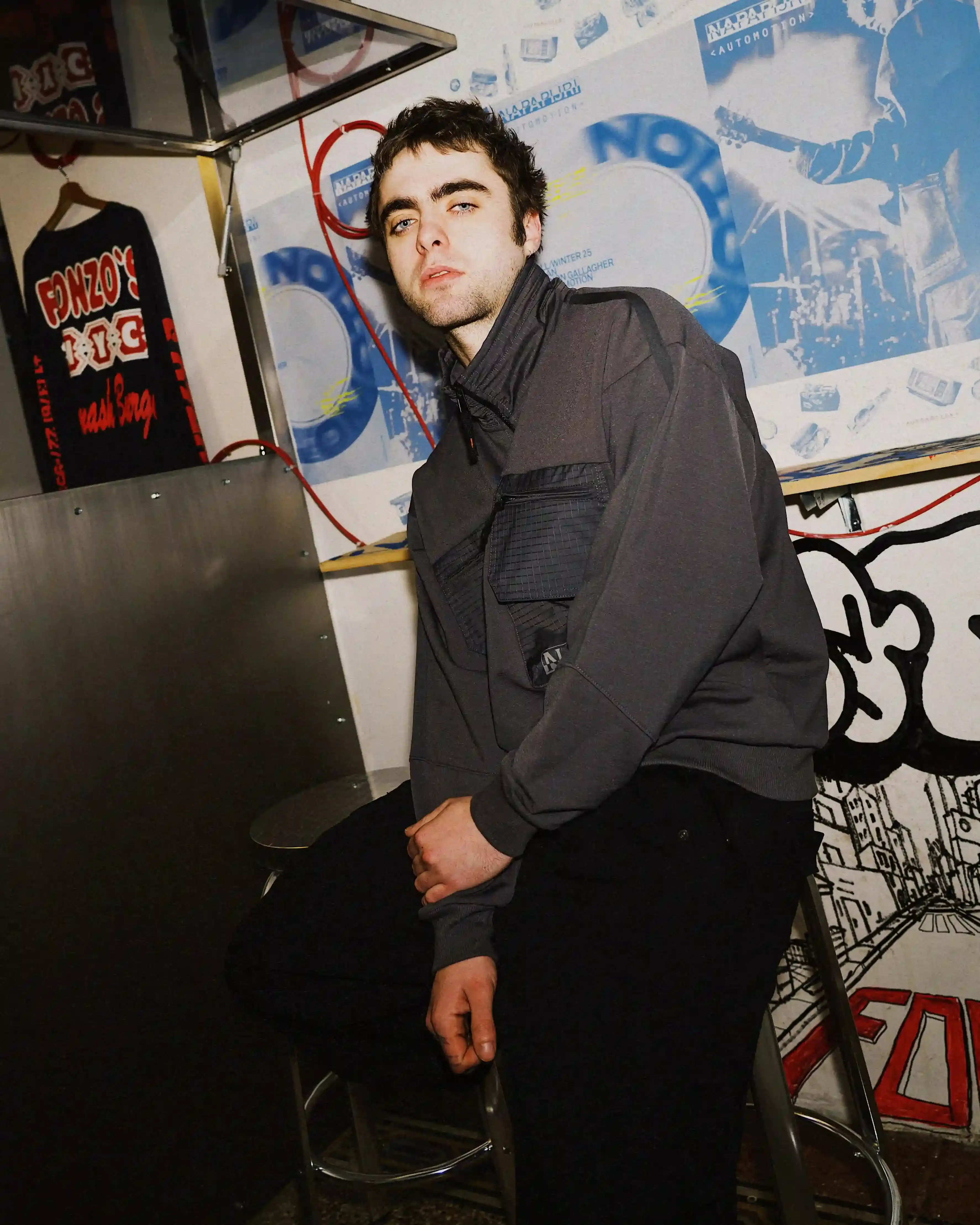 © Casawi | Matteo Vetrano image of Lennon Gallagher, featuring a Q&A format discussion about his modeling work with Napapijri, his band activities, daily routines, and personal influences including David Bowie. The article reveals his casual approach to life, balancing music practice with modeling, and his preference for a laid-back lifestyle. shoot by Matteo Vetrano