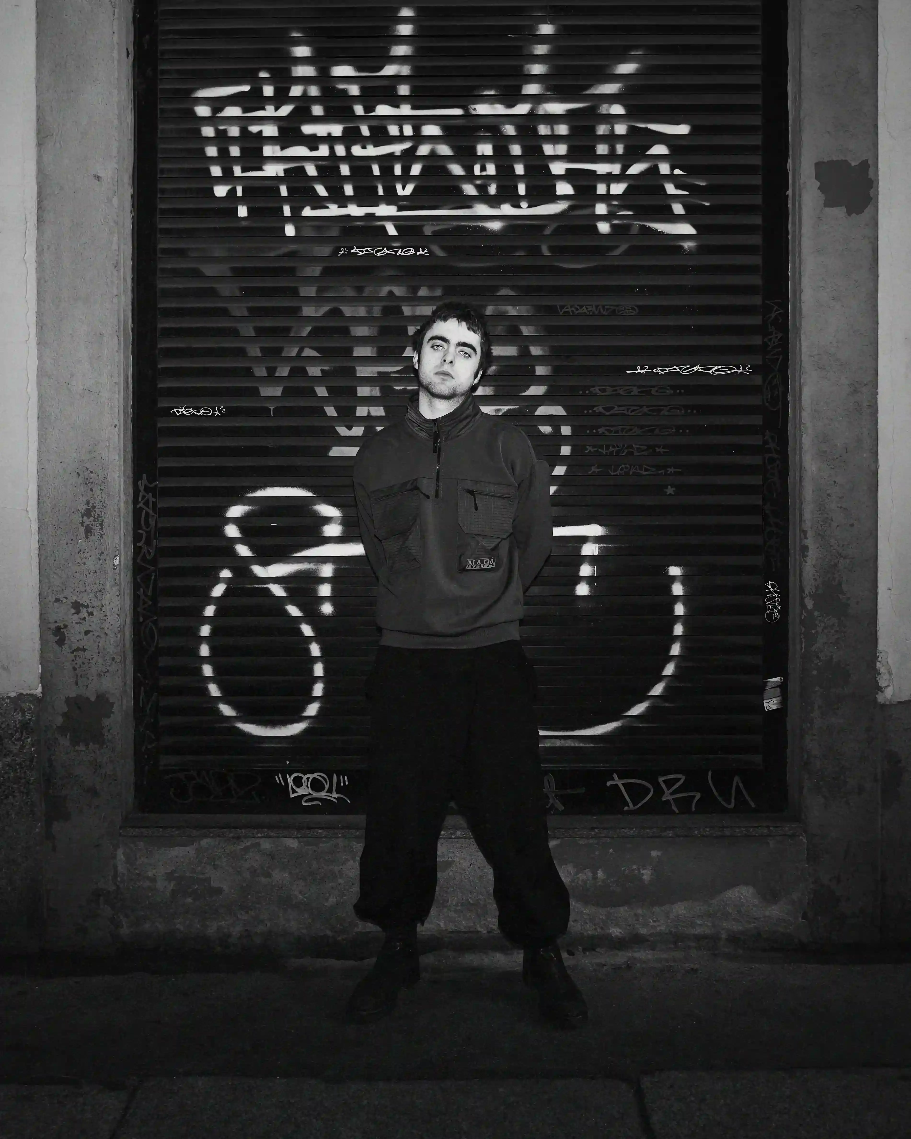 © Casawi | Matteo Vetrano image of Lennon Gallagher, featuring a Q&A format discussion about his modeling work with Napapijri, his band activities, daily routines, and personal influences including David Bowie. The article reveals his casual approach to life, balancing music practice with modeling, and his preference for a laid-back lifestyle. shoot by Matteo Vetrano (image 3 of 13)
