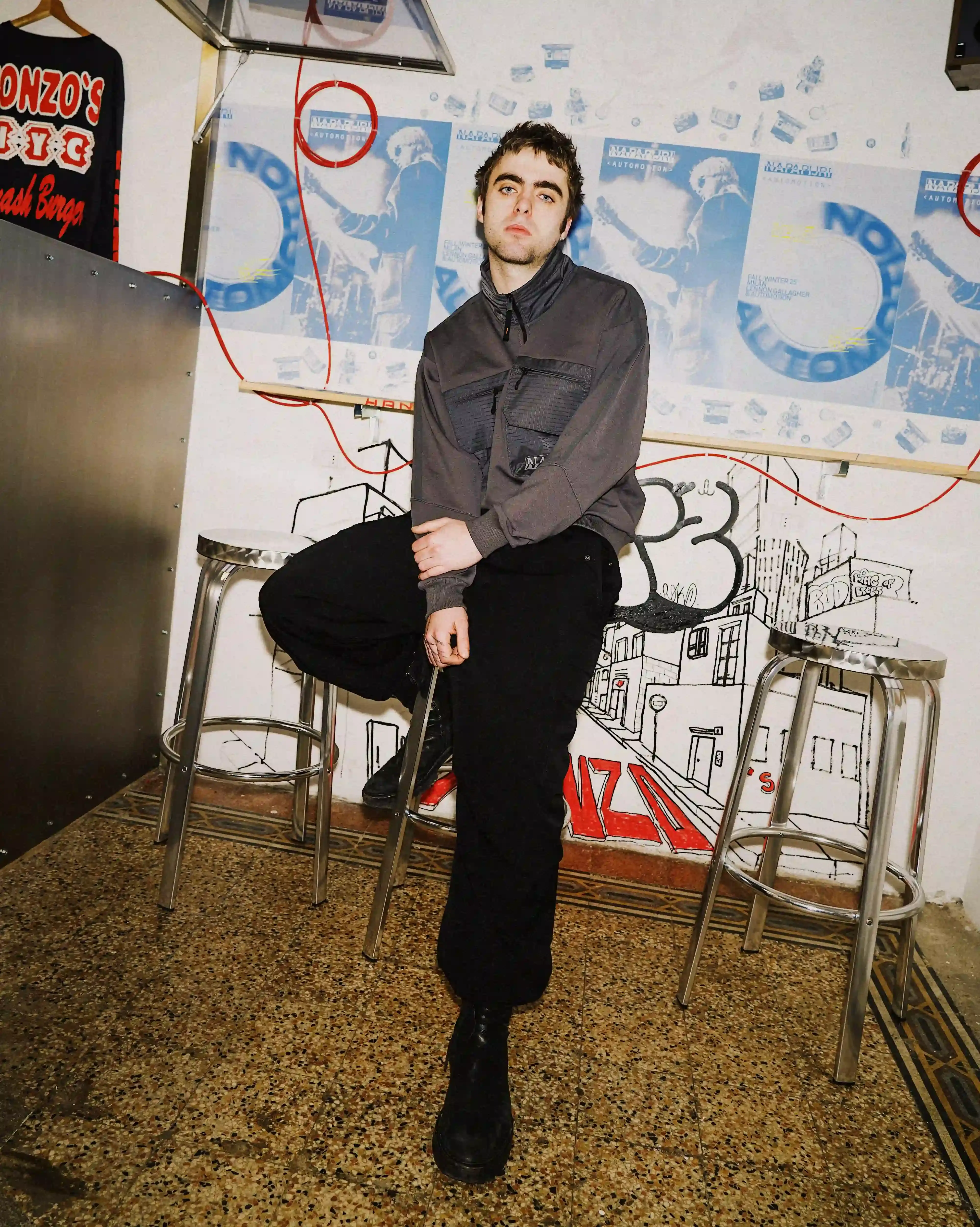 © Casawi | Matteo Vetrano image of Lennon Gallagher, featuring a Q&A format discussion about his modeling work with Napapijri, his band activities, daily routines, and personal influences including David Bowie. The article reveals his casual approach to life, balancing music practice with modeling, and his preference for a laid-back lifestyle. shoot by Matteo Vetrano (image 4 of 13)