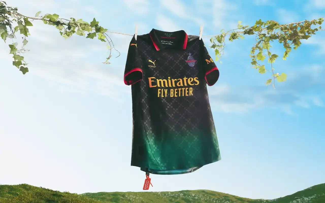 AC Milan AC Milan's 2025 fourth kit collaboration with PUMA and Off-White™, showing two versions: a black to power green gradient jersey with yellow logos and red accents, and an alternate red to power green gradient jersey with monochromatic club crest and yellow details. Both feature Off-White™'s signature design elements including quotation marks and zip ties. The shirts display the 'Diavoli' nickname on the chest and incorporate a modified arrow pattern throughout. (image 13 of 13)