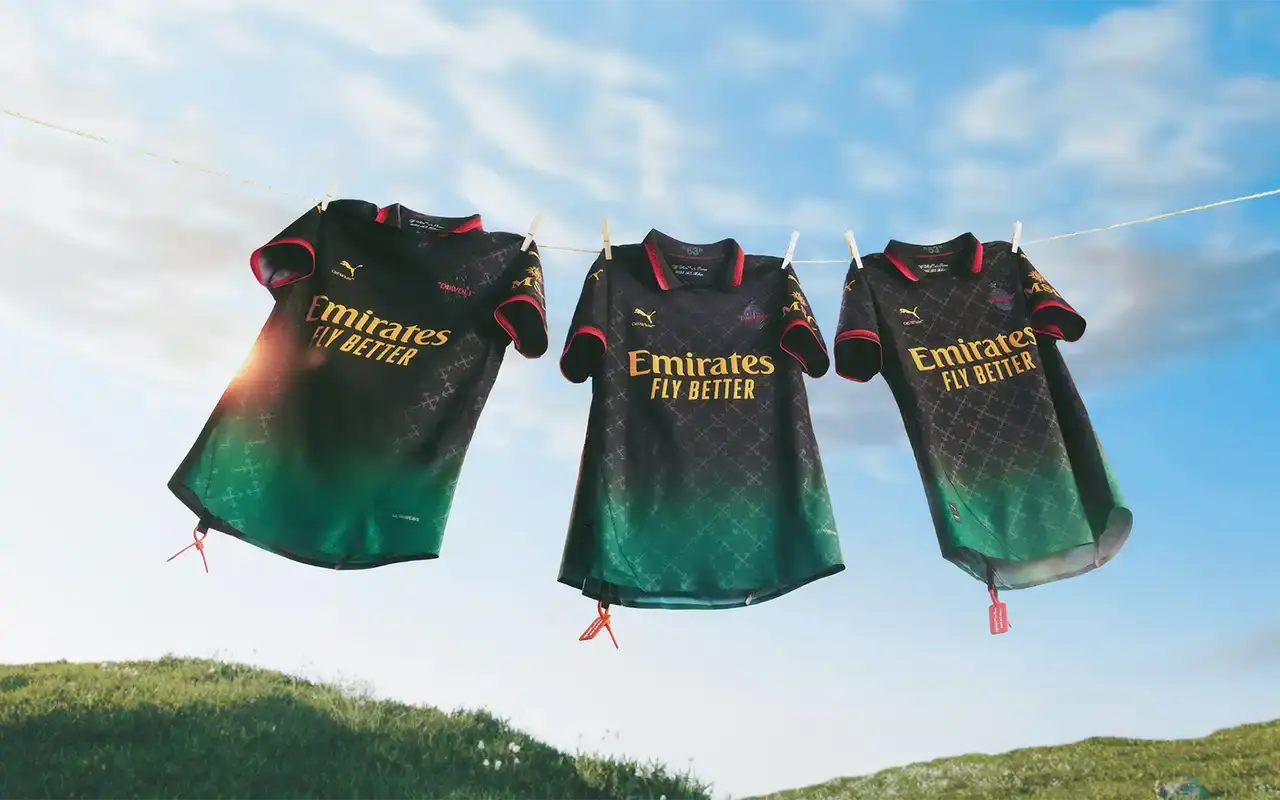 AC Milan AC Milan's 2025 fourth kit collaboration with PUMA and Off-White™, showing two versions: a black to power green gradient jersey with yellow logos and red accents, and an alternate red to power green gradient jersey with monochromatic club crest and yellow details. Both feature Off-White™'s signature design elements including quotation marks and zip ties. The shirts display the 'Diavoli' nickname on the chest and incorporate a modified arrow pattern throughout. (image 12 of 13)