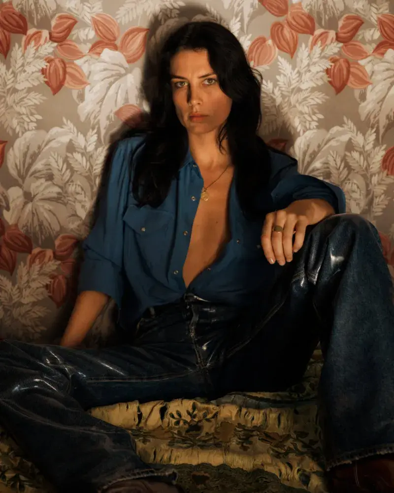 ACNE STUDIOS MARKS 30 YEARS WITH A NAN GOLDIN CAMPAIGN image of the Acne Studios 30-year anniversary denim collection photographed by Nan Goldin featuring brand collaborators. (image 2 of 12)