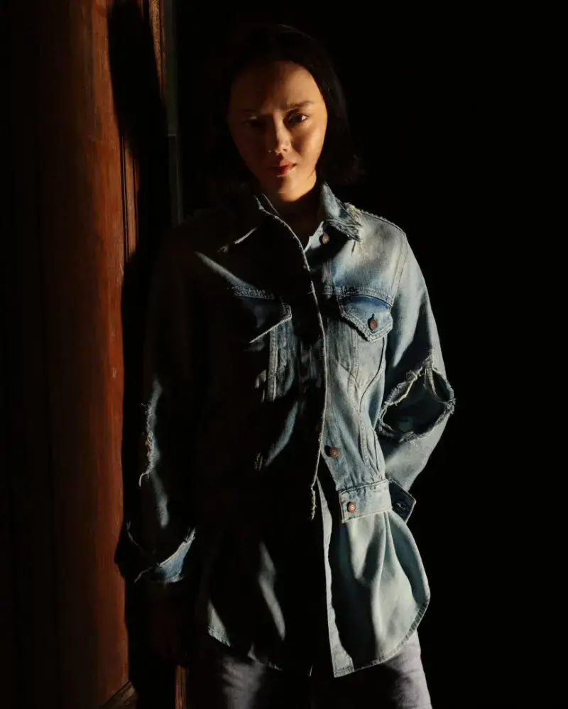 ACNE STUDIOS MARKS 30 YEARS WITH A NAN GOLDIN CAMPAIGN image of the Acne Studios 30-year anniversary denim collection photographed by Nan Goldin featuring brand collaborators. (image 9 of 12)
