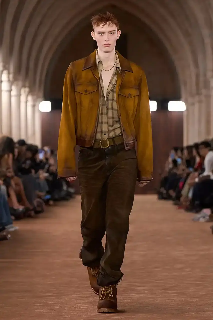 ACNE STUDIOS AND TIMBERLAND COLLABORATE ON 6-INCH BOOT Acne Studios presented a collaborative 6-Inch boot with Timberland during its Spring/Summer 2026 Paris Fashion Week runway show. The boot features washed brown tones and minimal design changes. (image 3 of 3)