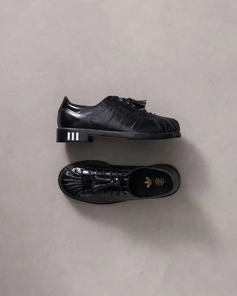 Colt/Adidas Black tailored suit and modified Superstar sneakers from CLOT x adidas Originals collaboration displayed against neutral background" (image 3 of 3)