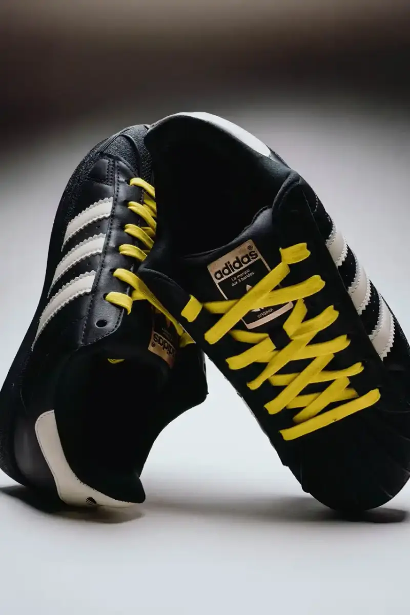 A Ma Maniére The Pharrell x adidas Virginia Superstar 92 sneaker in Off White colorway, showing its oversized silhouette with thick padding and classic shell toe design against a neutral background. (image 5 of 6)