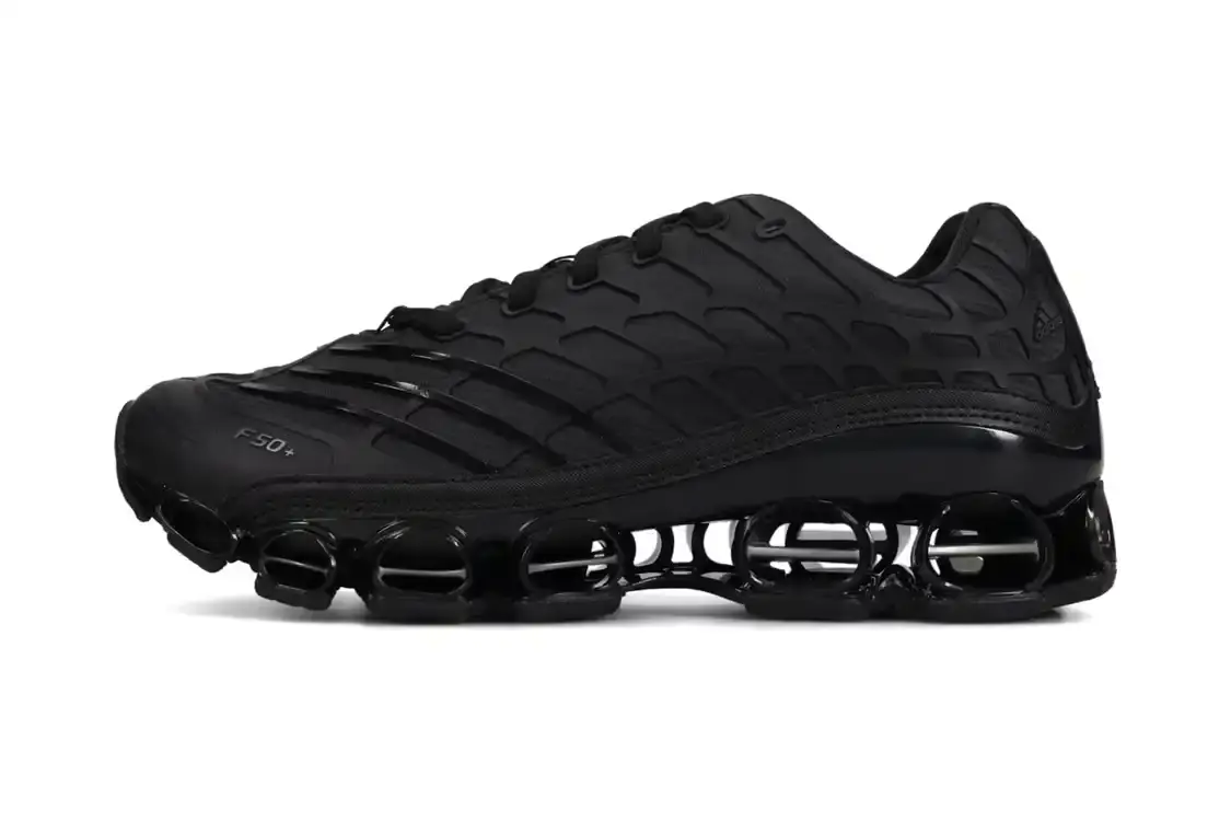 DIDAS MEGARIDE F50 LAUNCHES JANUARY 2026 adidas releases Megaride F50 sneaker in Core Black colorway with wavy grid overlays and hollowed-out sole on January 1, 2026 for $180 USD.