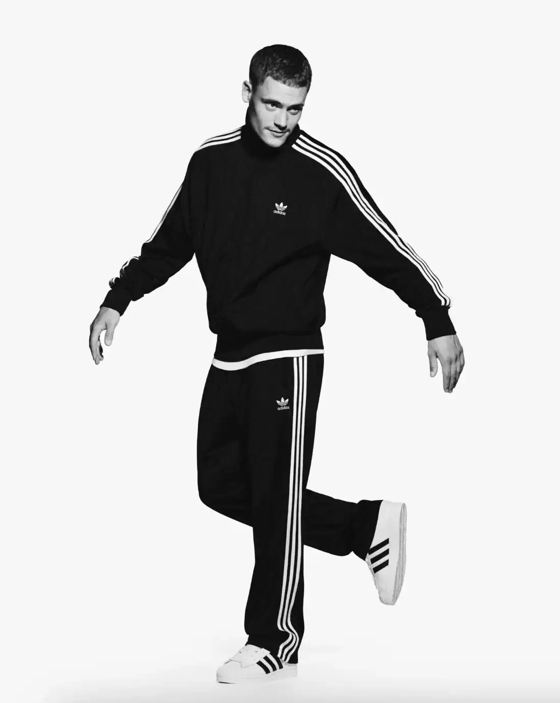 ADIDAS SUPERSTAR CAMPAIGN STARS STORMZY, BELLINGHAM, KEOGHAN image covers Adidas campaign featuring celebrities wearing iconic Superstar sneakers and Firebird tracksuits in black and white photography. (image 14 of 18)