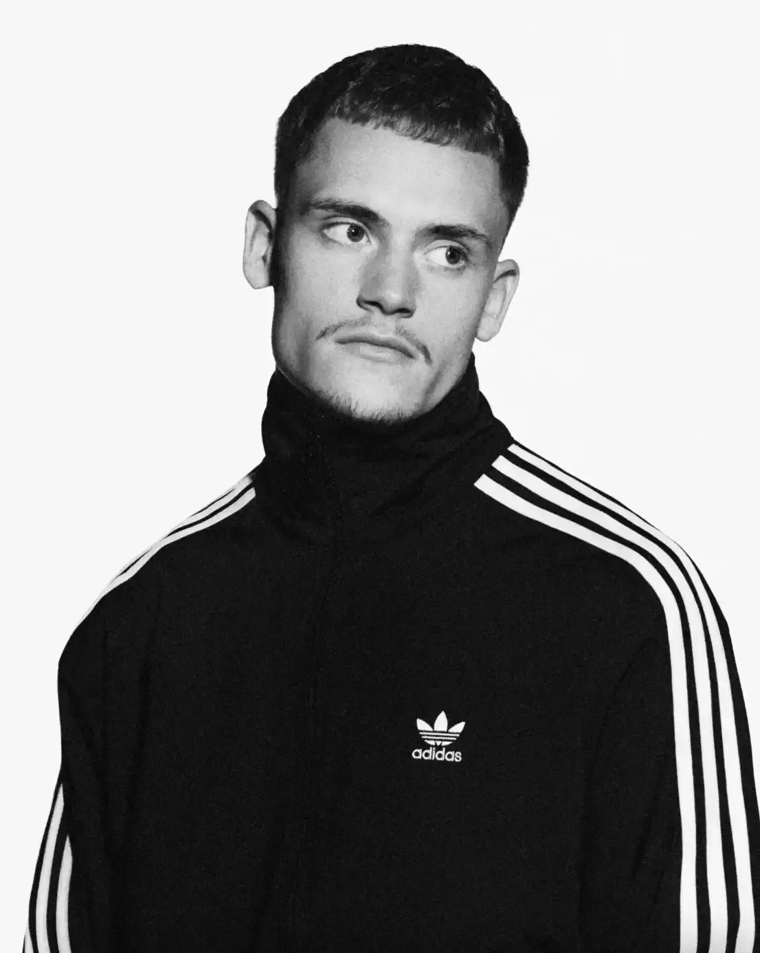 ADIDAS SUPERSTAR CAMPAIGN STARS STORMZY, BELLINGHAM, KEOGHAN image covers Adidas campaign featuring celebrities wearing iconic Superstar sneakers and Firebird tracksuits in black and white photography. (image 13 of 18)