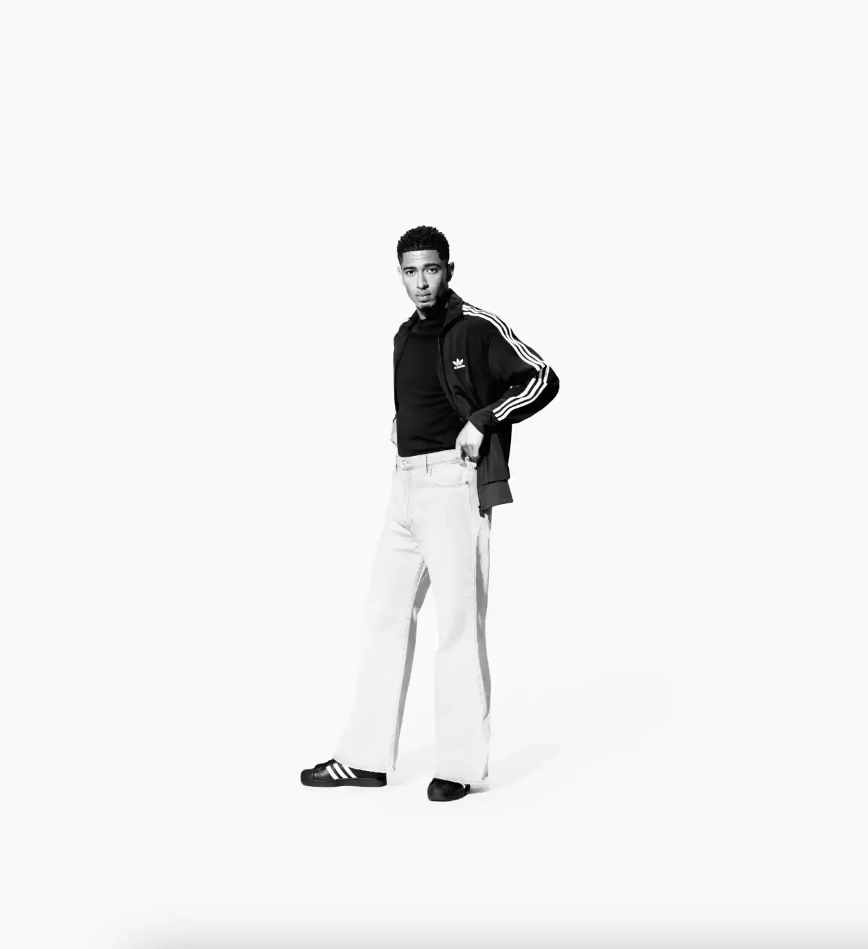 ADIDAS SUPERSTAR CAMPAIGN STARS STORMZY, BELLINGHAM, KEOGHAN image covers Adidas campaign featuring celebrities wearing iconic Superstar sneakers and Firebird tracksuits in black and white photography. (image 12 of 18)