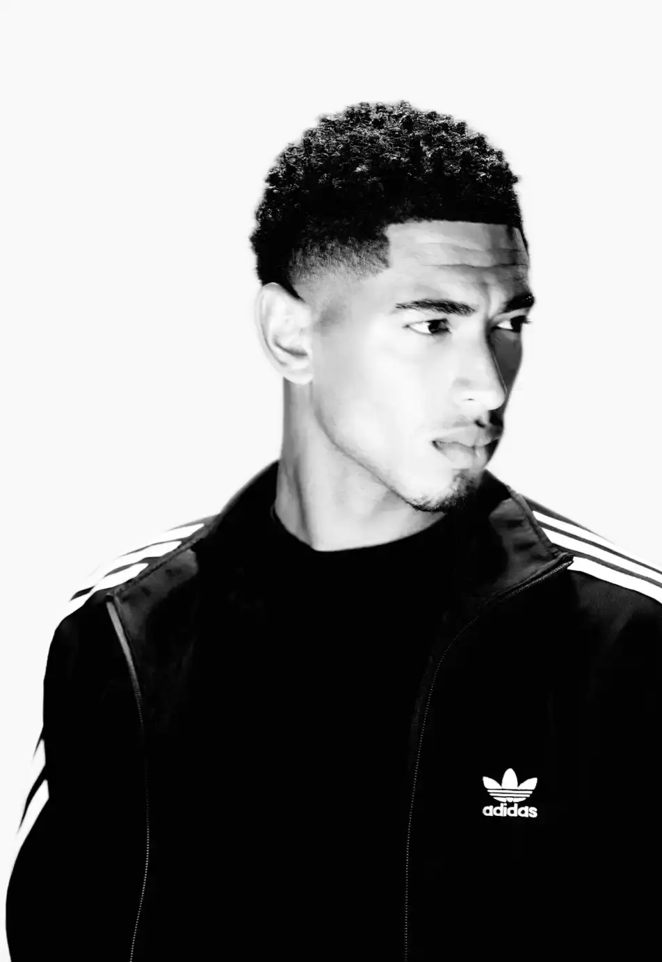 ADIDAS SUPERSTAR CAMPAIGN STARS STORMZY, BELLINGHAM, KEOGHAN image covers Adidas campaign featuring celebrities wearing iconic Superstar sneakers and Firebird tracksuits in black and white photography. (image 11 of 18)