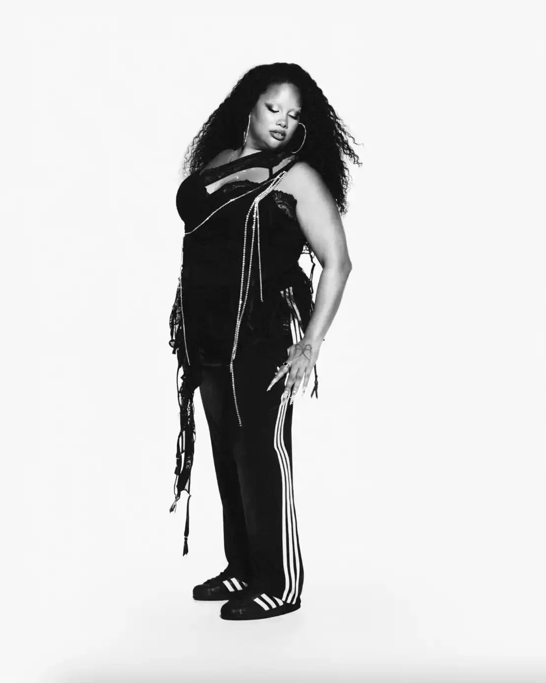 ADIDAS SUPERSTAR CAMPAIGN STARS STORMZY, BELLINGHAM, KEOGHAN image covers Adidas campaign featuring celebrities wearing iconic Superstar sneakers and Firebird tracksuits in black and white photography. (image 9 of 18)