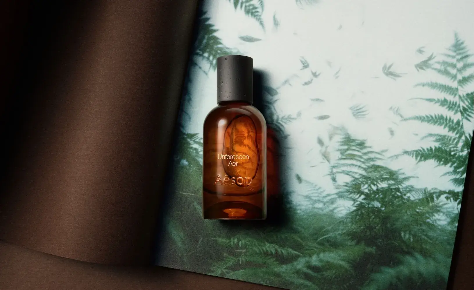image about Aesop Fragrant Fables, a line of 12 eaux de parfum with fable-style names, poems, a new scent called Unforeseen Aer and a redesigned amber bottle with a basalt-inspired cap.