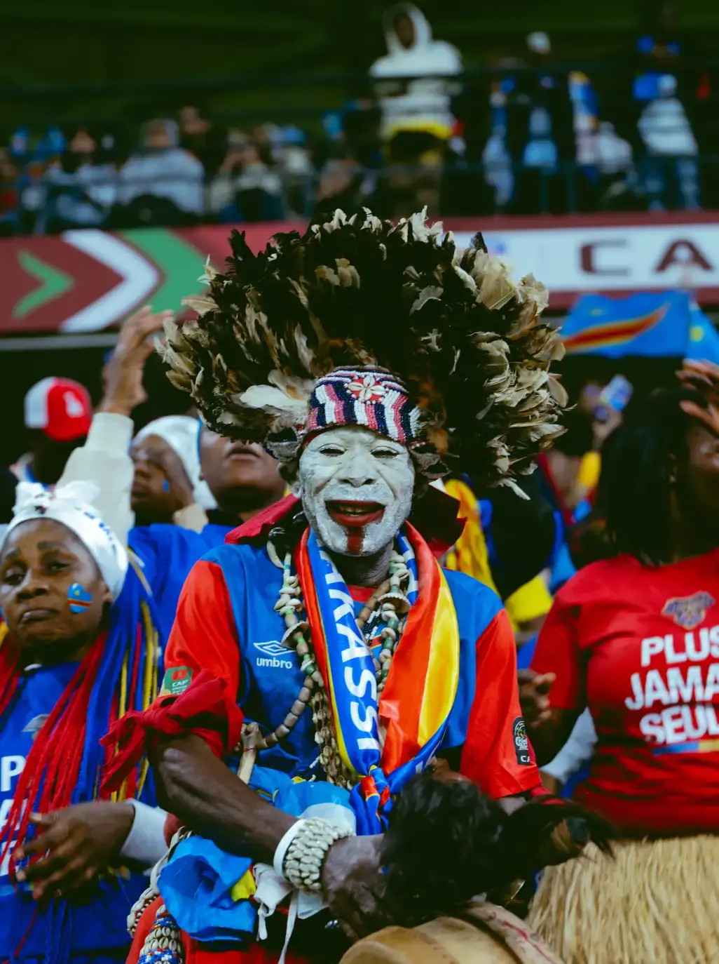 AFCON 2025 AND THE MOMENT FOOTBALL BECAME CULTURE Image photographs by Miguel the Colored Cowboy capture AFCON 2025 supporters in streets and stadiums. Images show clothing worn with purpose. Jerseys, tailored pieces, traditional fabrics, and sportswear appear across the frames. Faces show tension, pride, and focus. Clothing looks lived in. Scarves, jackets, and footwear respond to weather and movement. No staging. No distance. The gallery documents how style serves the moment during match days. Each image places viewers inside the crowd where expression stays personal and presence stays shared.