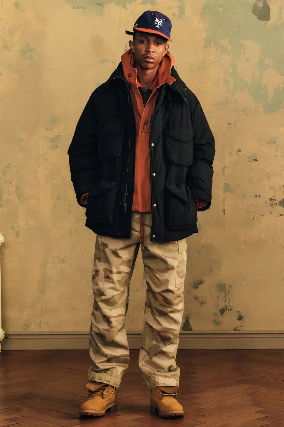 AIMÉ LEON DORE FW26 DELIVERY 2 ADDS PARKAS AND BOOTS image of Aimé Leon Dore’s Fall/Winter 2026 Delivery 2 release. It covers the outerwear, knitwear, Field Boot, New Balance sneakers, accessories and the October 9 launch details.