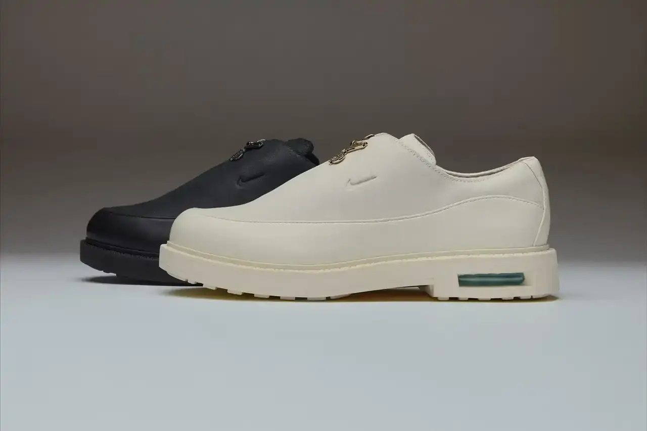 AIR AFRIQUE PARTNERS WITH NIKE FOR AVIATION-THEMED SHOE Black and white Air Max RK61 shoes featuring aviation-inspired design elements and Air Afrique branding (image 2 of 7)