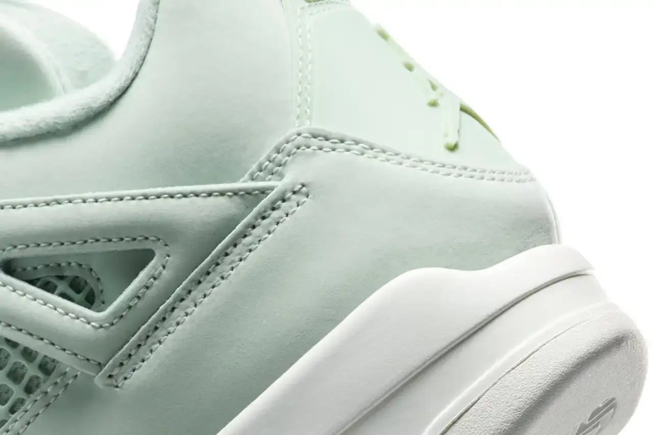 Nike Air Jordan 4 "Abundance" sneaker in monochromatic Seafoam green with Metallic Silver eyelets, featuring a sail-colored midsole and outsole. Shown from multiple angles displaying the tonal Jumpman logo on tongue and heel tab (image 7 of 7)