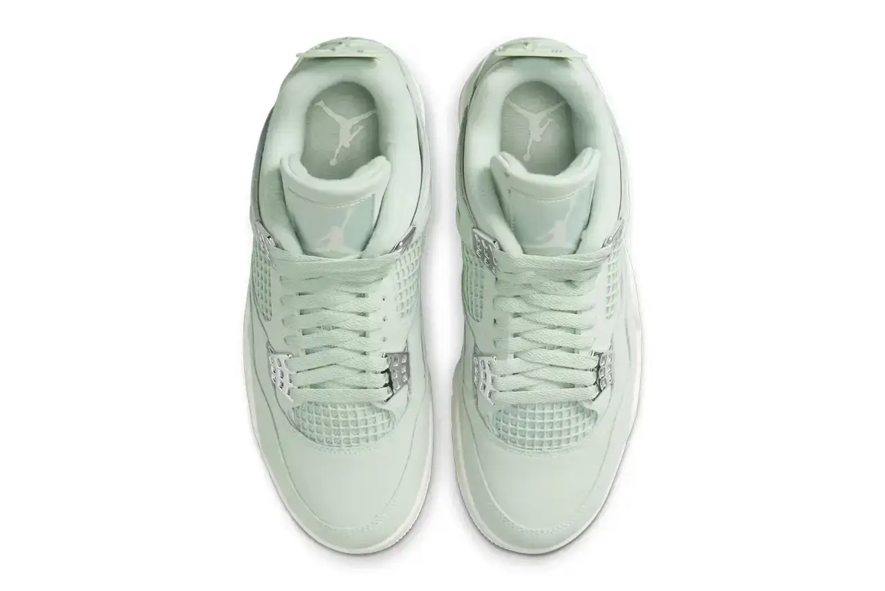 Nike Air Jordan 4 "Abundance" sneaker in monochromatic Seafoam green with Metallic Silver eyelets, featuring a sail-colored midsole and outsole. Shown from multiple angles displaying the tonal Jumpman logo on tongue and heel tab (image 4 of 7)