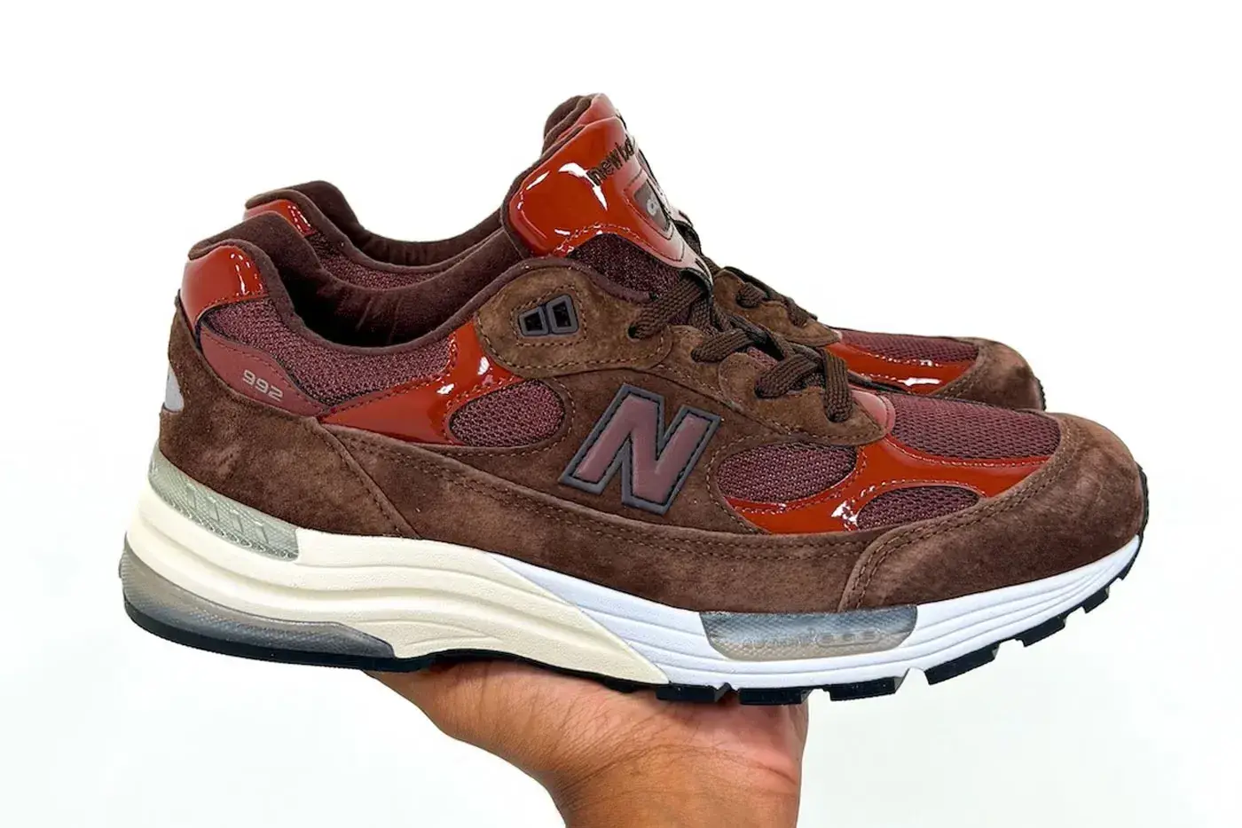 AMINÉ AND NEW BALANCE RELEASE THE 992 OUTDOOR SCHOOL image the upcoming release of the Aminé and New Balance 992 Outdoor School sneaker, detailing design features, materials, price, and release date. (image 2 of 15)