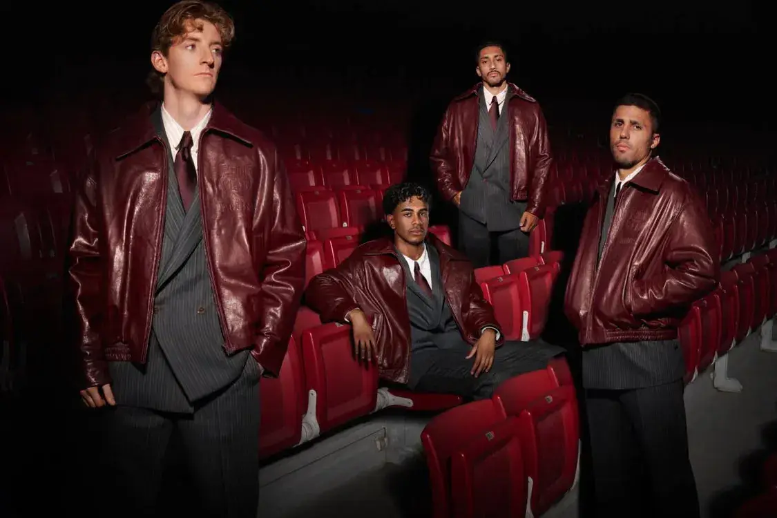 AMIRI OUTFITS FC BARCELONA IN TAILORED WOOL AND LEATHER A formal clothing collection by AMIRI for FC Barcelona players and executives, featuring striped wool suits, leather jackets, and travel accessories.