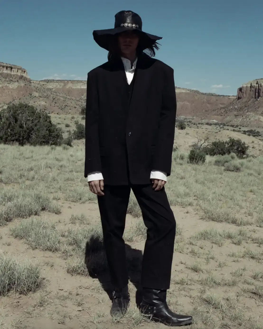 ANN DEMEULEMEESTER FW25 AT GHOST RANCH image of Fashion campaign article about Ann Demeulemeester's Fall/Winter 2025 collection photographed at Ghost Ranch in New Mexico, the former home of artist Georgia O'Keeffe. (image 2 of 8)