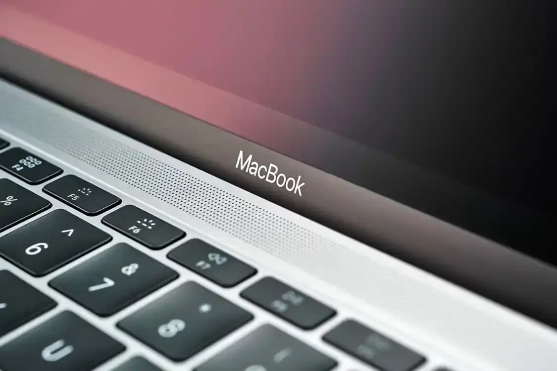 Apple logo on MacBook laptop computer