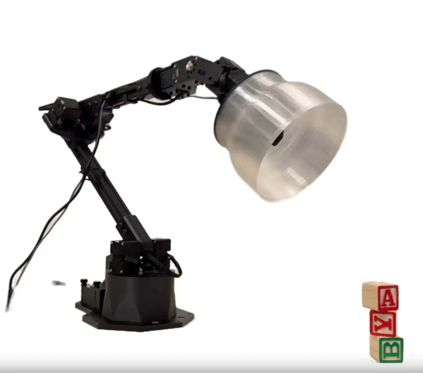 A white desk lamp with robotic features demonstrating movement by tilting its head toward a window, similar in design to Pixar's Luxo Jr. character.