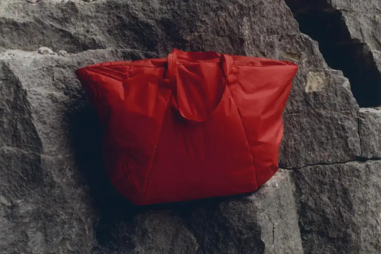 Arc'teryx Four-piece Arc'teryx SYSTEM_A DROP 08 collection featuring black and red OGEE jackets, insulated bucket hat, and large tote bag (image 4 of 4)