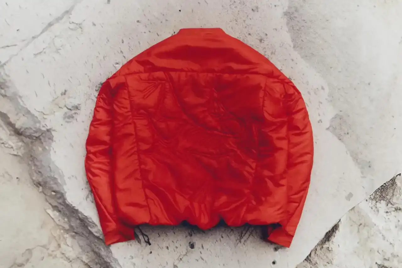 Arc'teryx Four-piece Arc'teryx SYSTEM_A DROP 08 collection featuring black and red OGEE jackets, insulated bucket hat, and large tote bag (image 2 of 4)