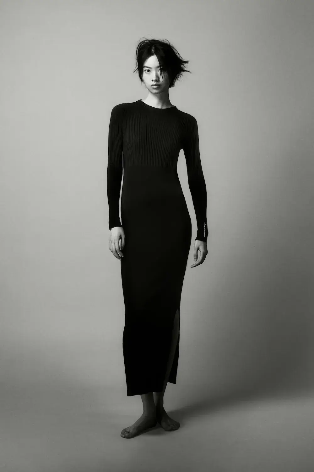 ARMANI EXCHANGE RELAUNCHES BASICS CAMPAIGN Black and white portrait photography from the Armani Exchange Basics campaign set against a neutral studio background. (image 13 of 16)