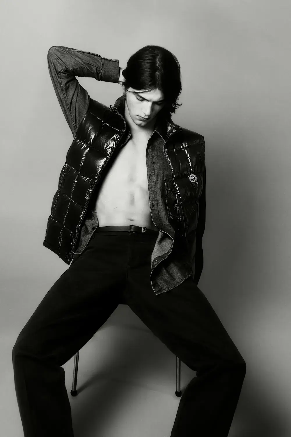 ARMANI EXCHANGE RELAUNCHES BASICS CAMPAIGN Black and white portrait photography from the Armani Exchange Basics campaign set against a neutral studio background. (image 8 of 16)