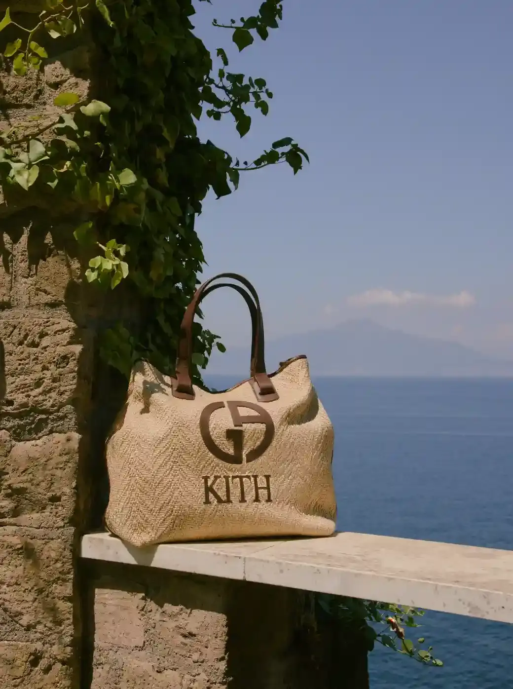ARMANI & KITH LAUNCH SECOND COLLECTION image of the second Giorgio Armani and Kith collaborative fashion collection called "Estate." The collection includes both men's and women's clothing and accessories inspired by coastal destinations in Italy and America. Key details include product descriptions, materials used, launch dates, and availability information across multiple retail channels. (image 3 of 9)