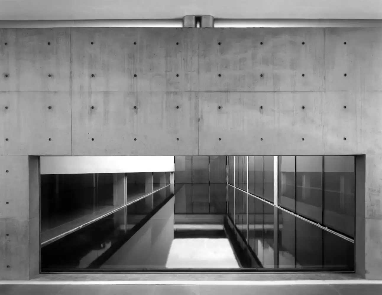 ARMANI'S HIDDEN THEATER IN MILAN image about Giorgio Armani's theater venue in Milan, created through collaboration with Japanese architect Tadao Ando by transforming a former industrial building into a cultural space for fashion shows and events. (image 3 of 7)