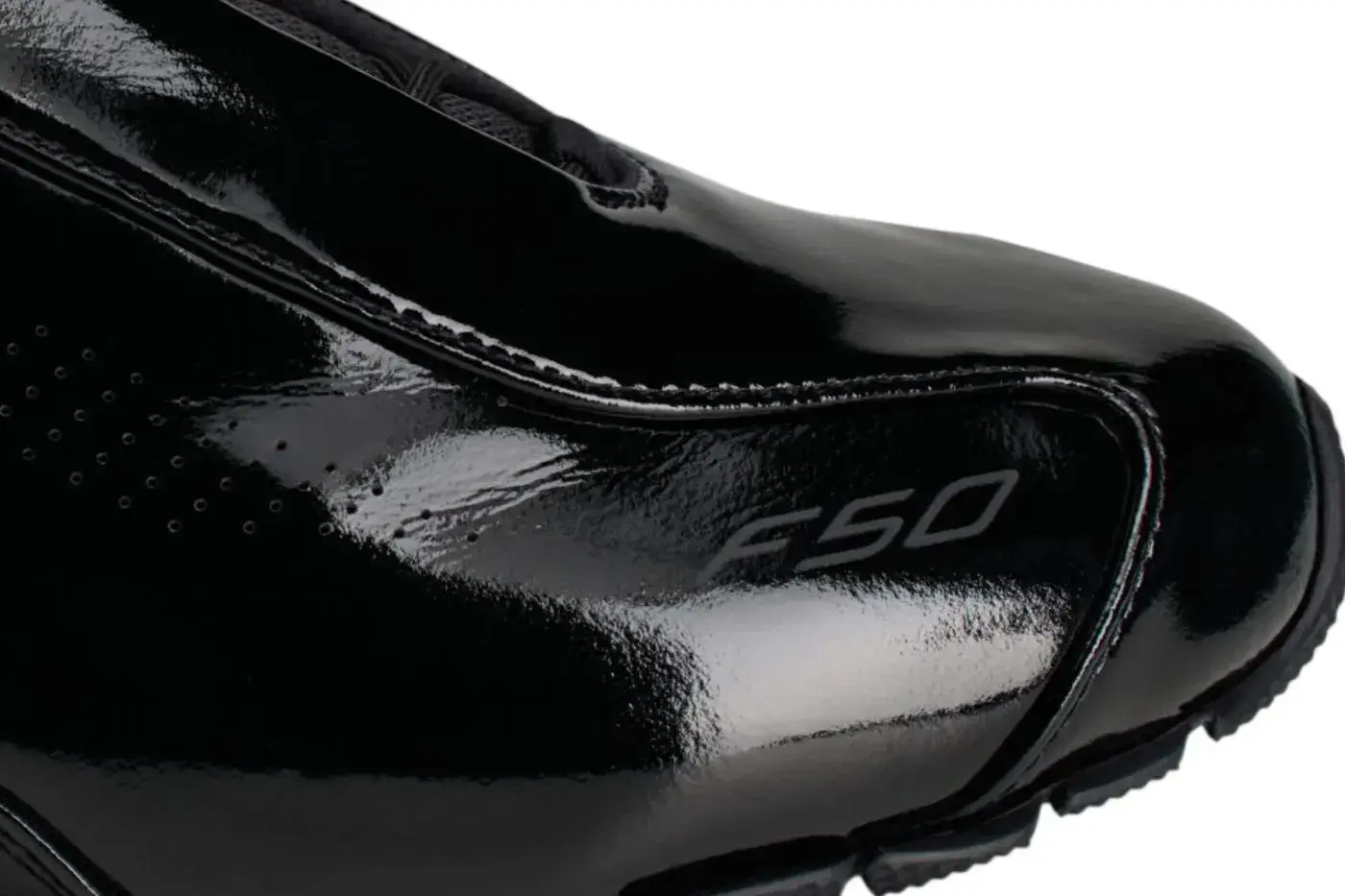 ARTE ANTWERP ADIDAS F50 PATENT LEATHER image overview of the Arte Antwerp and adidas F50 sneaker release in black patent leather detailing product features, pricing, and launch dates. (image 6 of 7)