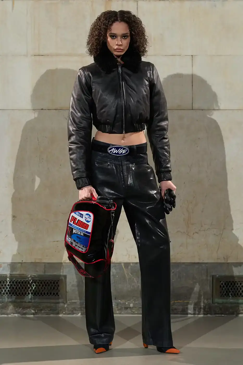 A$AP ROCKY TURNS BACKSTAGE INTO RUNWAY AT NYFW AWGE presented its Fall/Winter 2026 collection at New York Fashion Week with models receiving hair and makeup on the runway. The show featured baby carriers, motorsport aesthetics, and new A$AP Rocky x PUMA footwear releases. (image 6 of 41)
