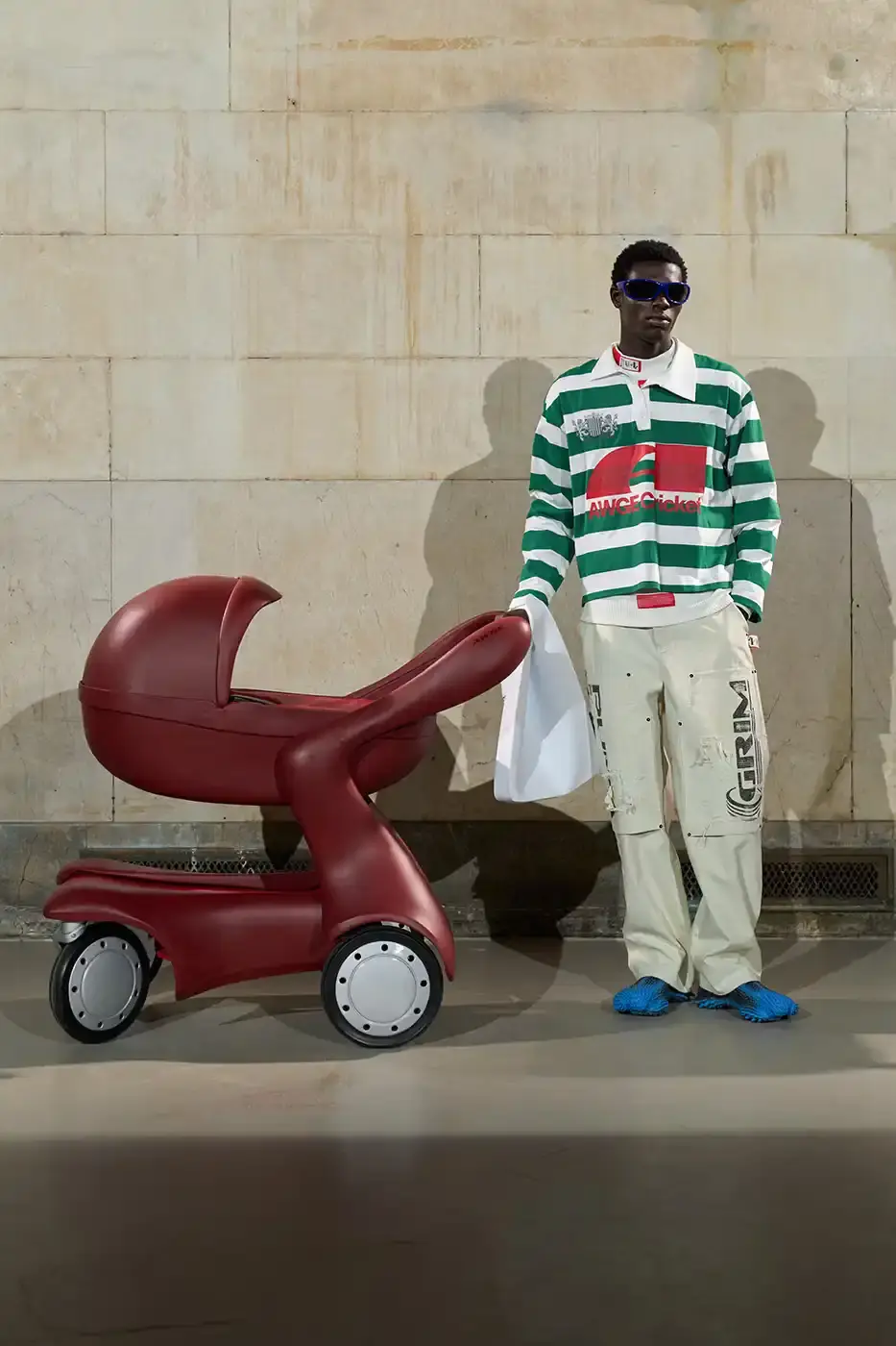 A$AP ROCKY TURNS BACKSTAGE INTO RUNWAY AT NYFW AWGE presented its Fall/Winter 2026 collection at New York Fashion Week with models receiving hair and makeup on the runway. The show featured baby carriers, motorsport aesthetics, and new A$AP Rocky x PUMA footwear releases. (image 14 of 41)