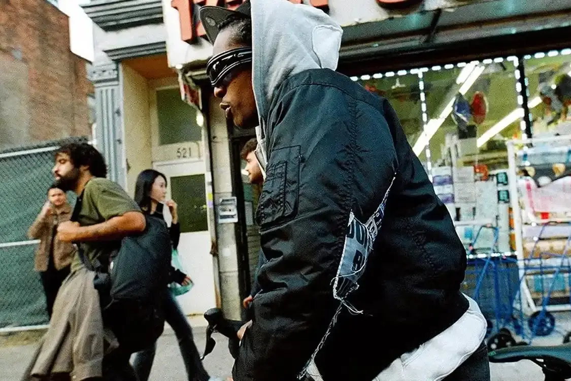 ROCKY'S RAY-BAN COLLECTION GOES ALL-BLACK image about A$AP Rocky's new Ray-Ban sunglasses collection. The rapper, serving as Ray-Ban's Creative Director, has released three black sunglasses models called Ultra Wrap 001, 002, and 003. The frames were shown at his Paris Fashion Week runway show and are available on Ray-Ban's website.