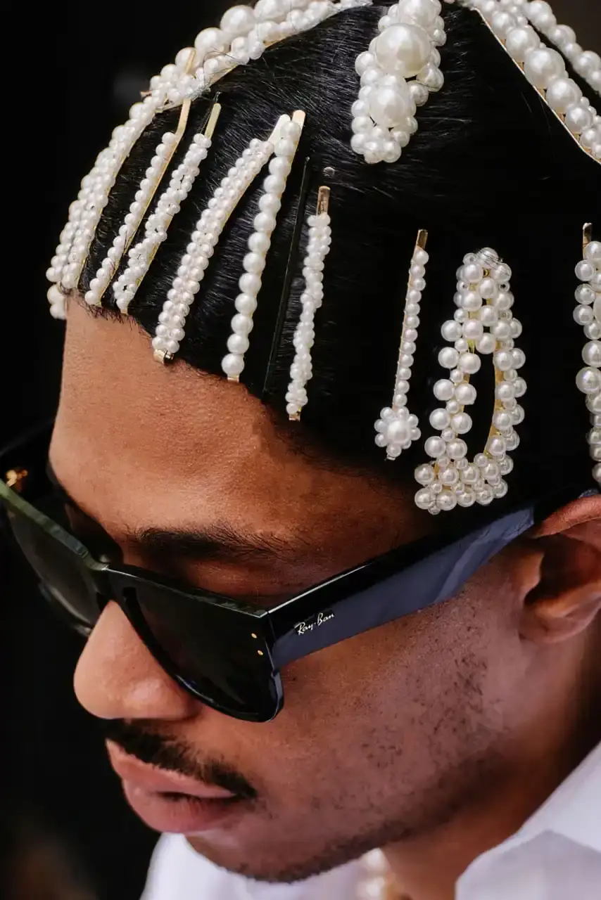 ROCKY UNVEILS RAY-BAN WAYFARER PUFFER COLLECTION image about A$AP Rocky's new Ray-Ban sunglasses collection. The Wayfarer Puffer frames come in seven colors and cost $202 each. The advertising campaign was photographed in Harlem using local residents as models. Rocky became Ray-Ban's Creative Director in February and previously wore custom versions of these sunglasses to the Met Gala and Cannes Film Festival. (image 6 of 10)