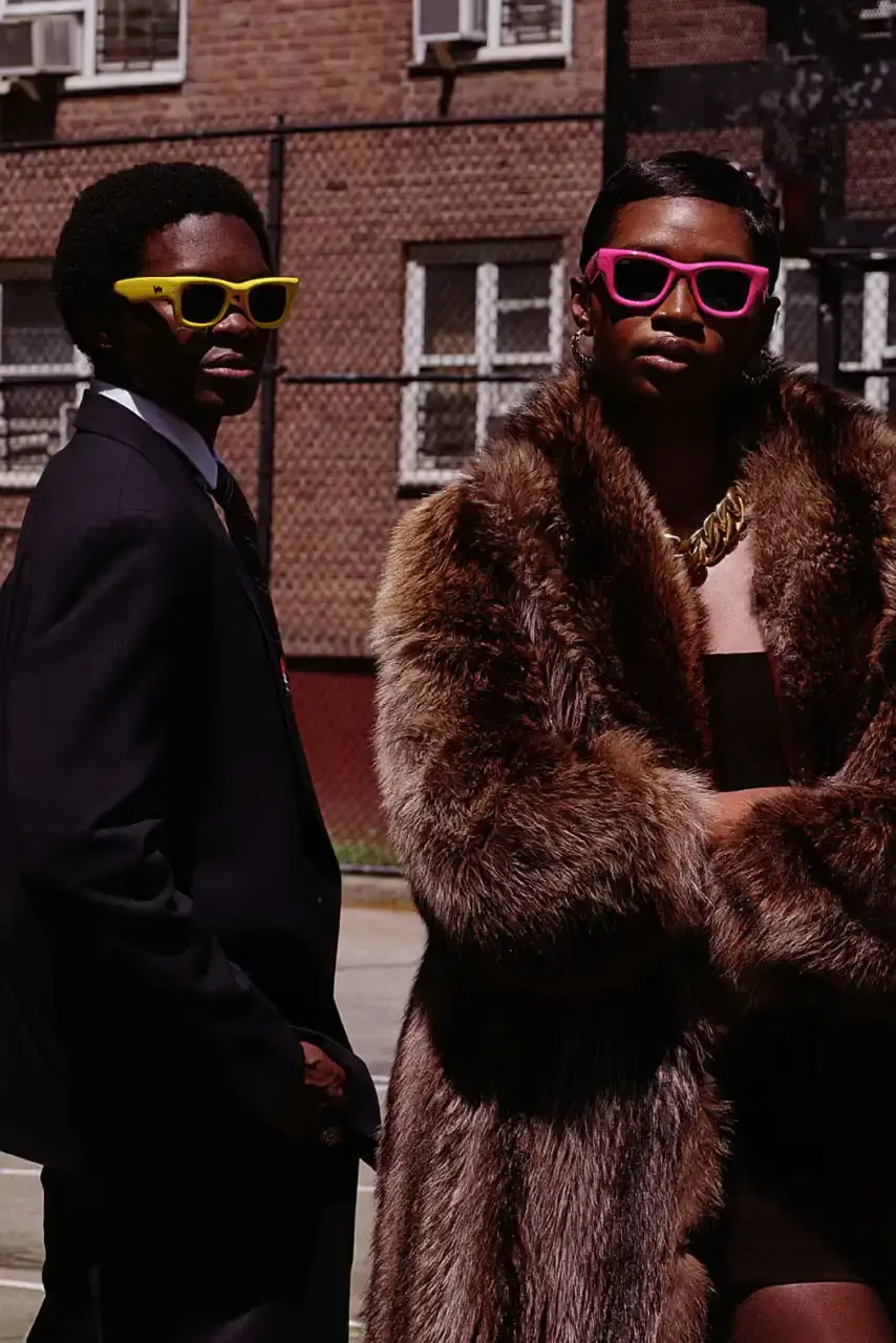 ROCKY UNVEILS RAY-BAN WAYFARER PUFFER COLLECTION image about A$AP Rocky's new Ray-Ban sunglasses collection. The Wayfarer Puffer frames come in seven colors and cost $202 each. The advertising campaign was photographed in Harlem using local residents as models. Rocky became Ray-Ban's Creative Director in February and previously wore custom versions of these sunglasses to the Met Gala and Cannes Film Festival. (image 9 of 10)