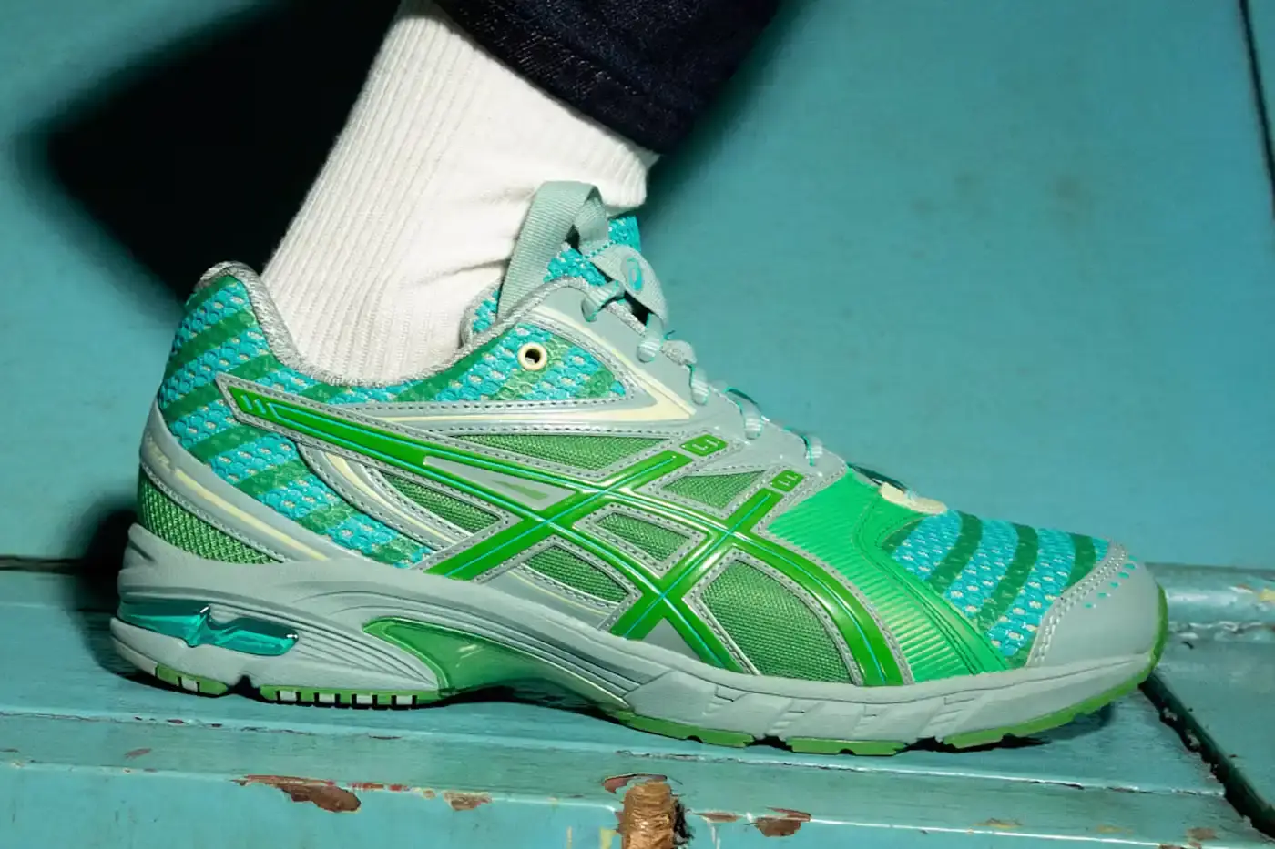 Asics ASICS GEL-DS Trainer 14 sneaker designed by Kiko Kostadinov, showing asymmetrical lacing system and multi-textured upper in gradient colorways. Four shoes displayed featuring Waterfall, Desert Camp, Dark Mustard, and Midnight color combinations. (image 2 of 4)
