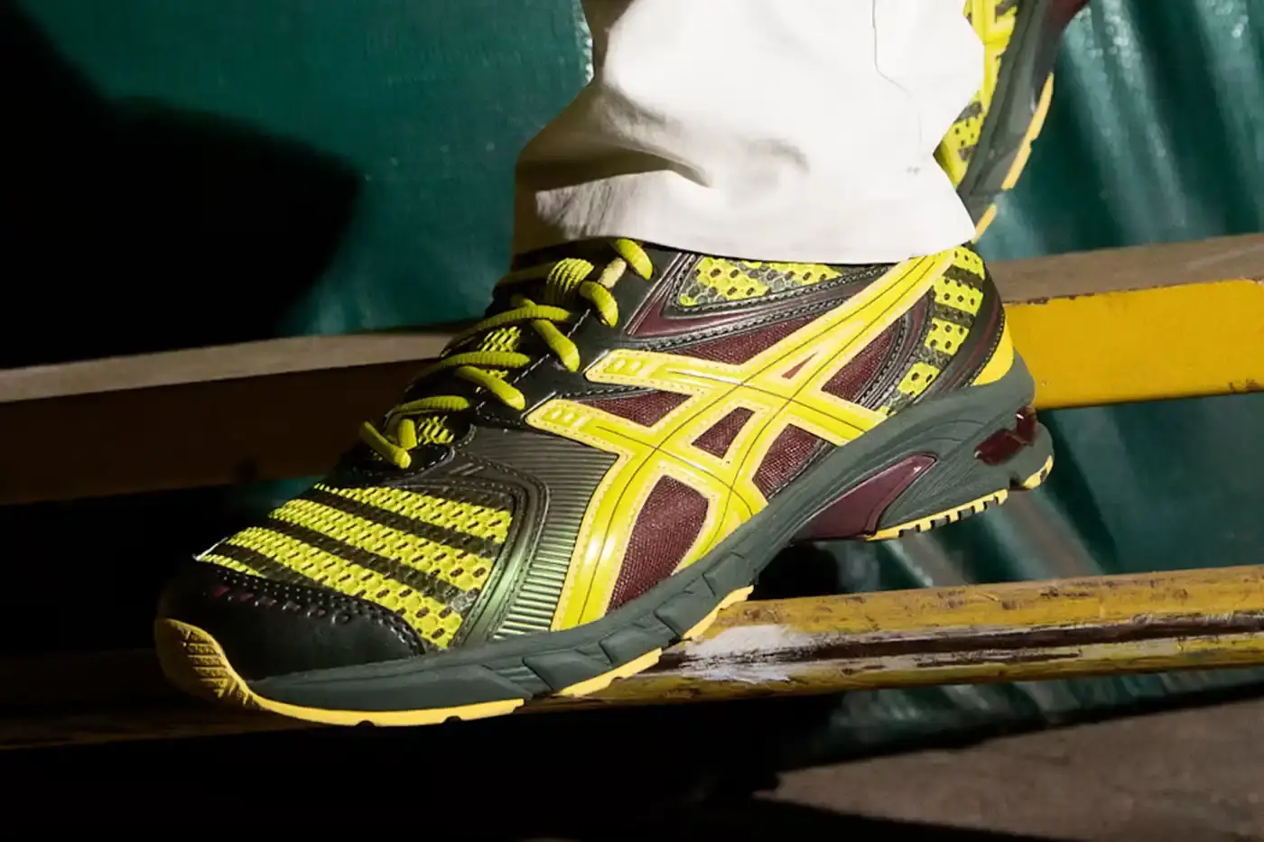 Asics ASICS GEL-DS Trainer 14 sneaker designed by Kiko Kostadinov, showing asymmetrical lacing system and multi-textured upper in gradient colorways. Four shoes displayed featuring Waterfall, Desert Camp, Dark Mustard, and Midnight color combinations. (image 4 of 4)