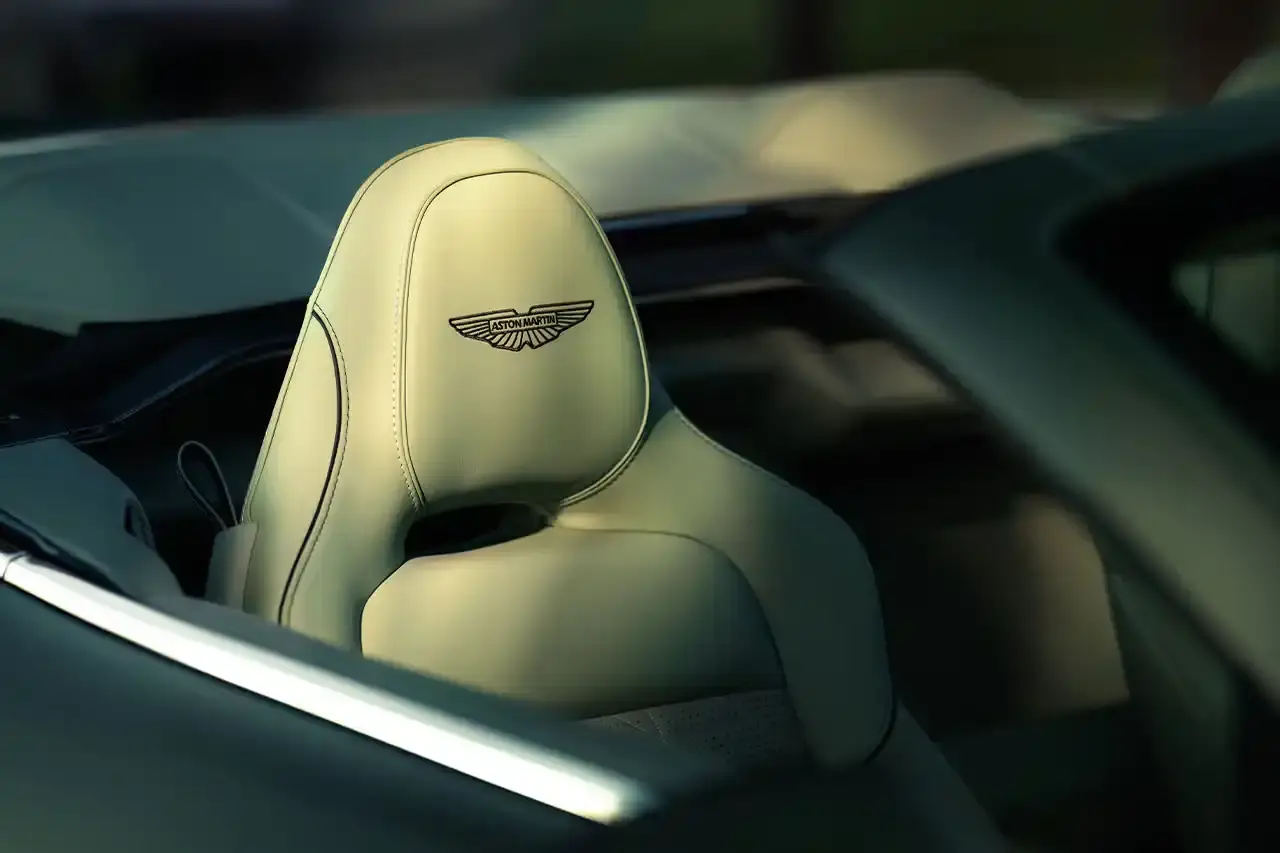ASTON MARTIN LAUNCHES LIMITED-EDITION VANQUISH VOLANTE The Aston Martin Vanquish Volante is a high-performance convertible featuring a 5.2L V12 engine, advanced engineering, and a luxurious interior. Limited to under 1,000 units annually, it represents a pinnacle of automotive design and technological innovation. (image 6 of 14)
