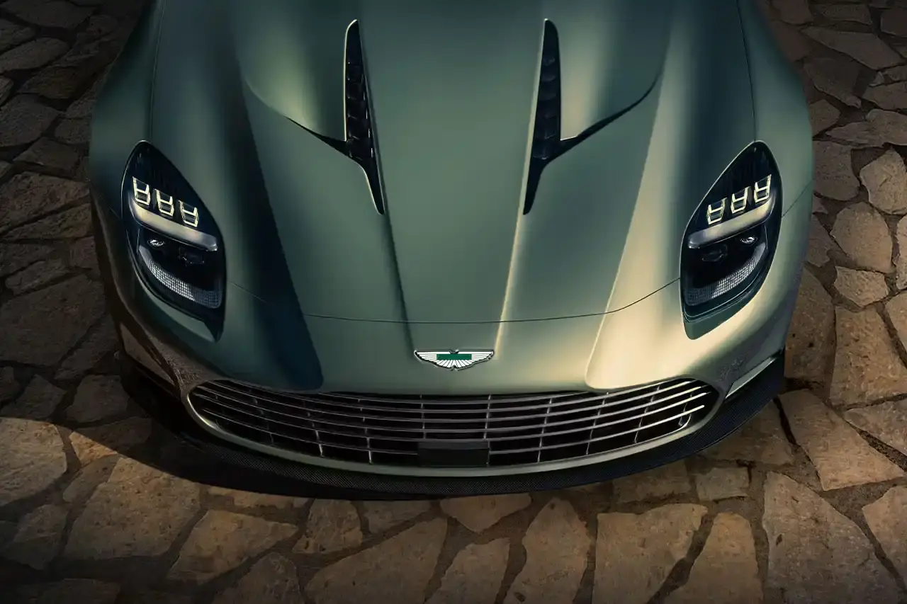 ASTON MARTIN LAUNCHES LIMITED-EDITION VANQUISH VOLANTE The Aston Martin Vanquish Volante is a high-performance convertible featuring a 5.2L V12 engine, advanced engineering, and a luxurious interior. Limited to under 1,000 units annually, it represents a pinnacle of automotive design and technological innovation. (image 13 of 14)