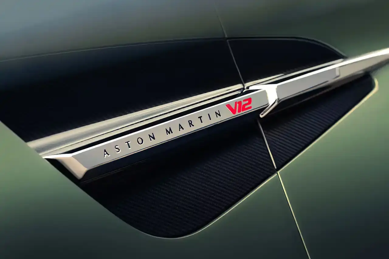 ASTON MARTIN LAUNCHES LIMITED-EDITION VANQUISH VOLANTE The Aston Martin Vanquish Volante is a high-performance convertible featuring a 5.2L V12 engine, advanced engineering, and a luxurious interior. Limited to under 1,000 units annually, it represents a pinnacle of automotive design and technological innovation. (image 12 of 14)