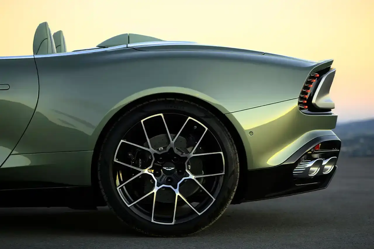 ASTON MARTIN LAUNCHES LIMITED-EDITION VANQUISH VOLANTE The Aston Martin Vanquish Volante is a high-performance convertible featuring a 5.2L V12 engine, advanced engineering, and a luxurious interior. Limited to under 1,000 units annually, it represents a pinnacle of automotive design and technological innovation. (image 5 of 14)