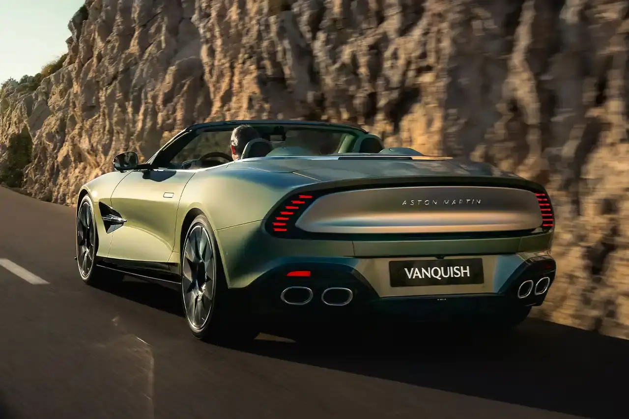 ASTON MARTIN LAUNCHES LIMITED-EDITION VANQUISH VOLANTE The Aston Martin Vanquish Volante is a high-performance convertible featuring a 5.2L V12 engine, advanced engineering, and a luxurious interior. Limited to under 1,000 units annually, it represents a pinnacle of automotive design and technological innovation. (image 2 of 14)