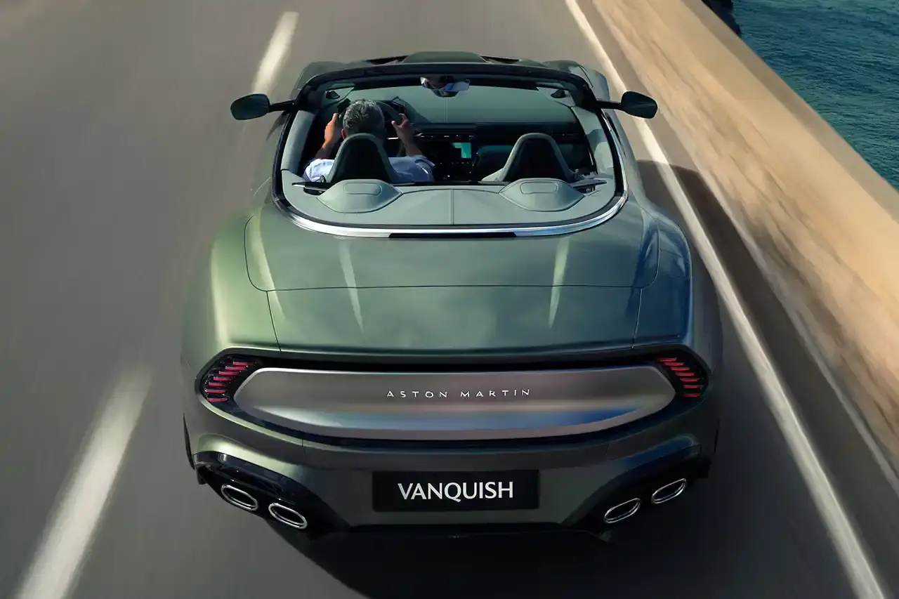 ASTON MARTIN LAUNCHES LIMITED-EDITION VANQUISH VOLANTE The Aston Martin Vanquish Volante is a high-performance convertible featuring a 5.2L V12 engine, advanced engineering, and a luxurious interior. Limited to under 1,000 units annually, it represents a pinnacle of automotive design and technological innovation. (image 4 of 14)