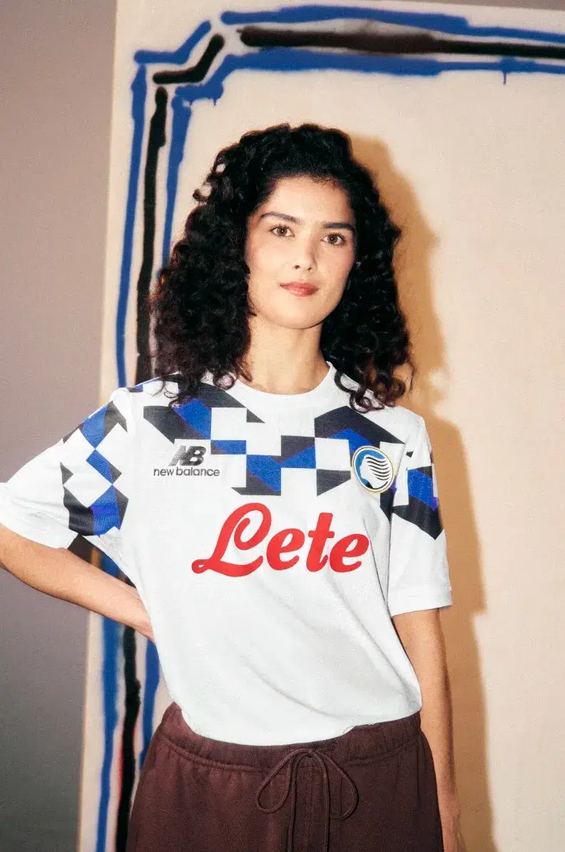 ATALANTA BC 2026 AWAY KIT BY NEW BALANCE image of the Atalanta BC 2026/27 New Balance white away jersey with black and Oasis Blue geometric accents. (image 3 of 3)