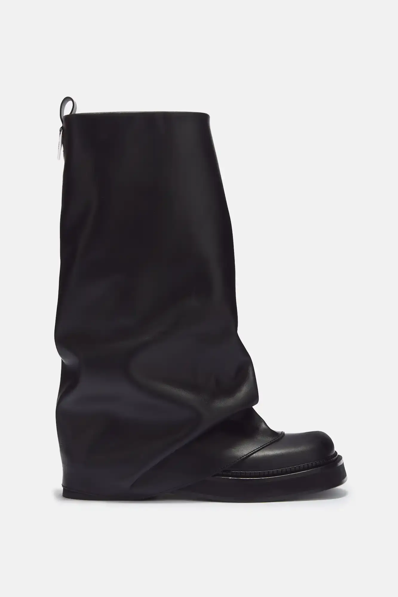 THE ATTICO ROBIN BOOTS EMERGE THIS FALL Article about The Attico's Robin Boots designed by Gilda Ambrosio and Giorgia Tordini, available in multiple styles and materials for fall weather.