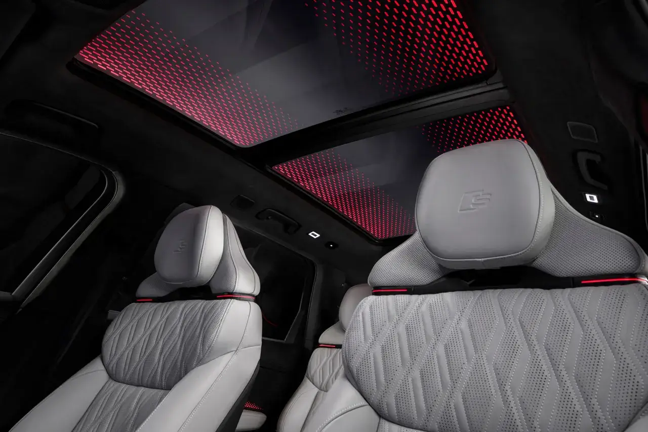 AUDI DEBUTS FULL SIZE Q9 SUV FAMILY image explaining Audi's new Q9 and SQ9 vehicle models, including engine performance, dimensions, exterior light projectors, and seating layouts. (image 13 of 14)